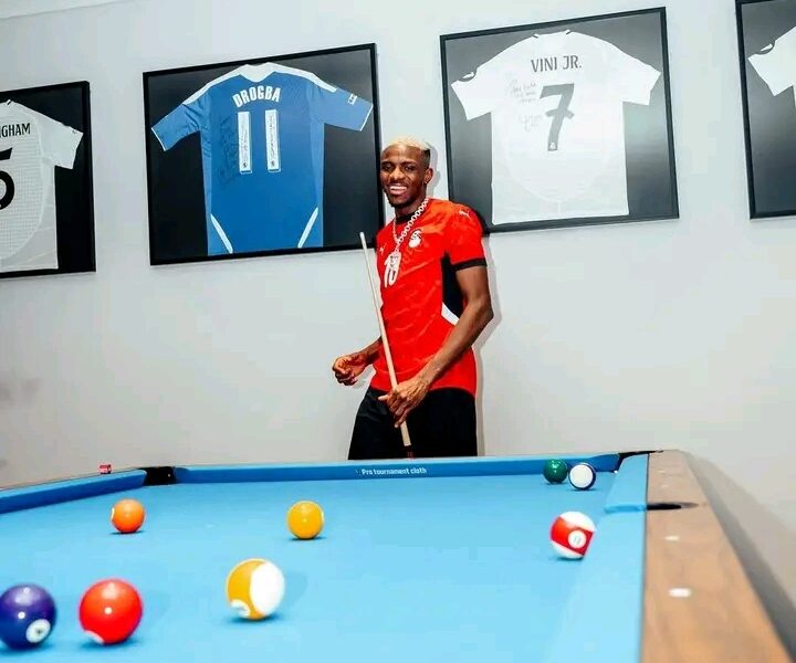 Victor Osimhen Spotted Wearing Mohamed Salah’s Jersey as Framed Shirts of Football Stars Adorn His Home