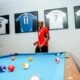 Victor Osimhen Spotted Wearing Mohamed Salah’s Jersey as Framed Shirts of Football Stars Adorn His Home