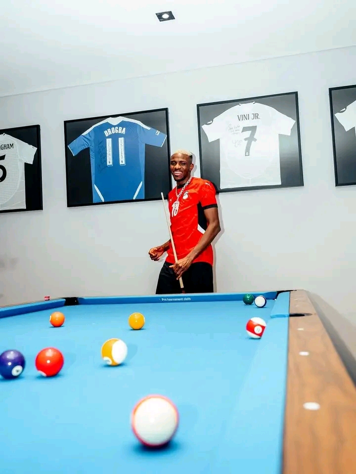 Victor Osimhen Spotted Wearing Mohamed Salah’s Jersey as Framed Shirts of Football Stars Adorn His Home