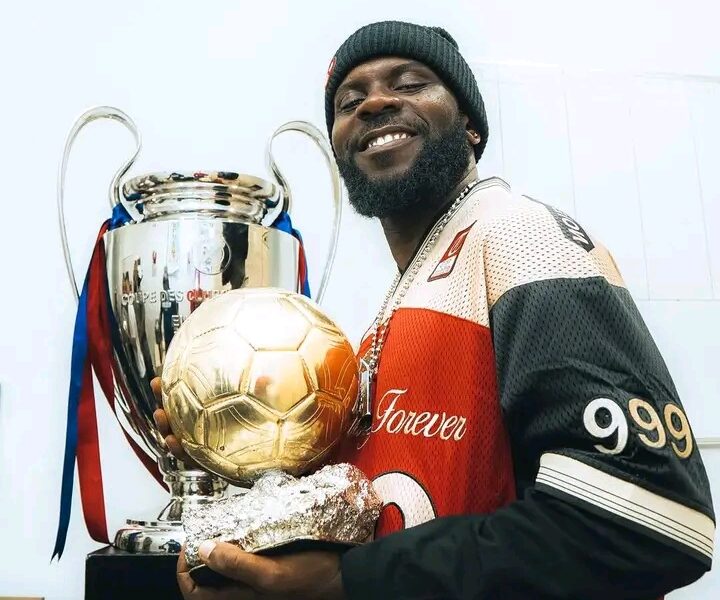 Odumodublvck Visits Spotify Camp Nou, Poses With Lionel Messi’s Prestigious Awards